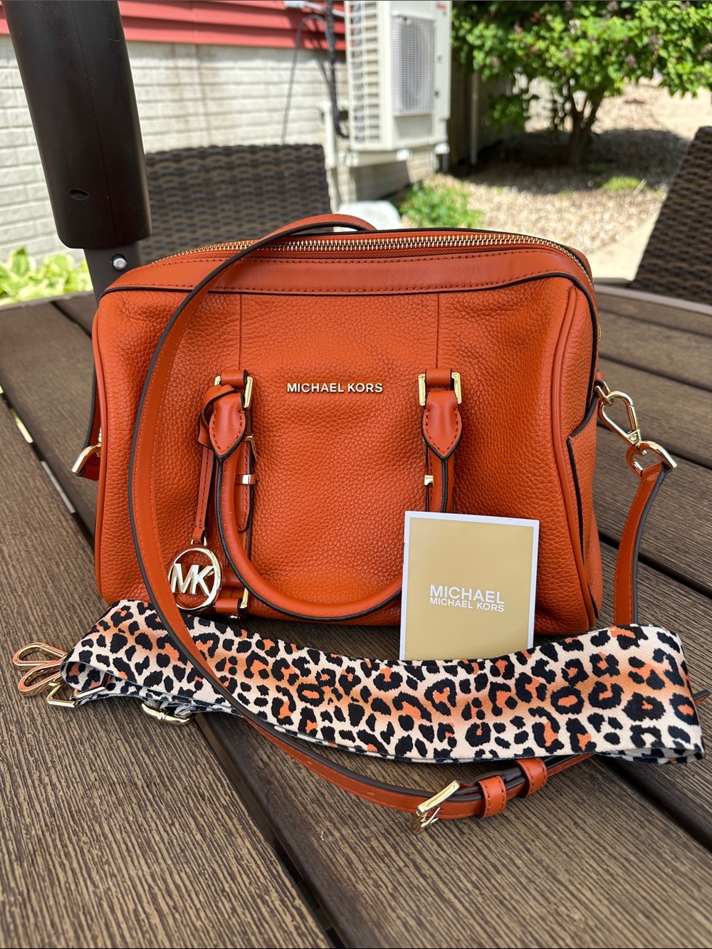 Michael Kors Bedford Legacy Orange Pebbled Leather Satchelwith Leopard Strap.